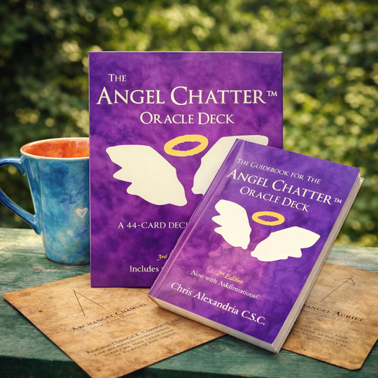 The Angel Chatter Oracle Deck' with a mug on a wooden surface outdoors.